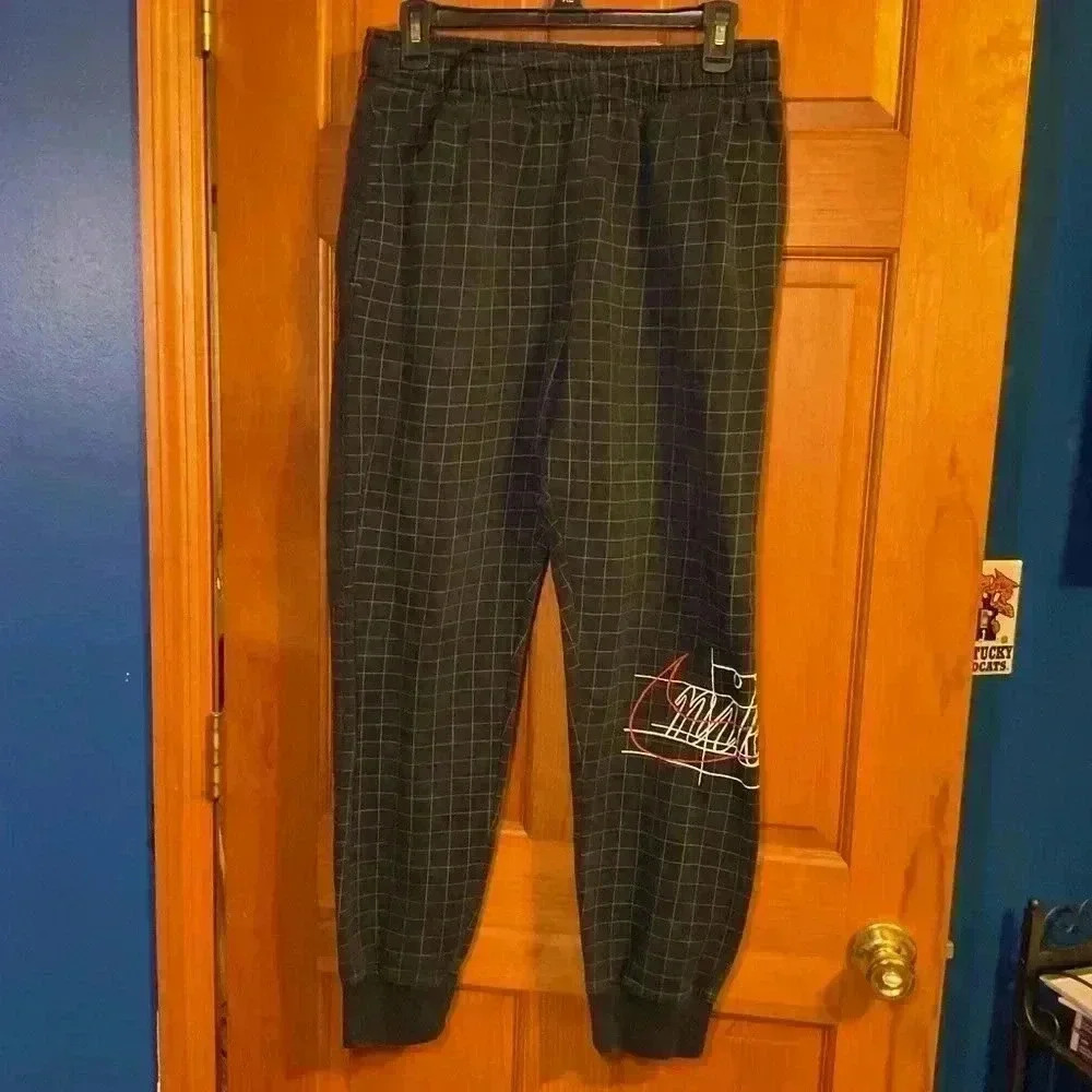 Nike Story of Swish Black Grid Men’s Joggers. Size Medium